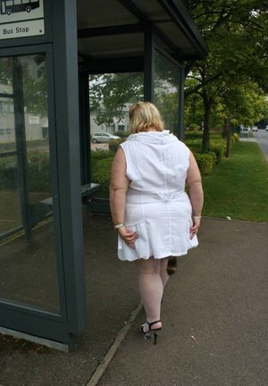 Mature blonde nurse Stevie Lix unveiling shaved pussy beneath uniform